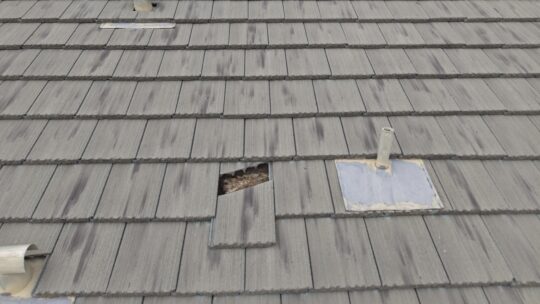 UV degraded tile roof underlayment in Arizona showing deterioration beneath roof tiles